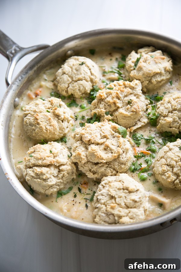 dairy-free chicken pot pie in a pan with GF biscuit topping