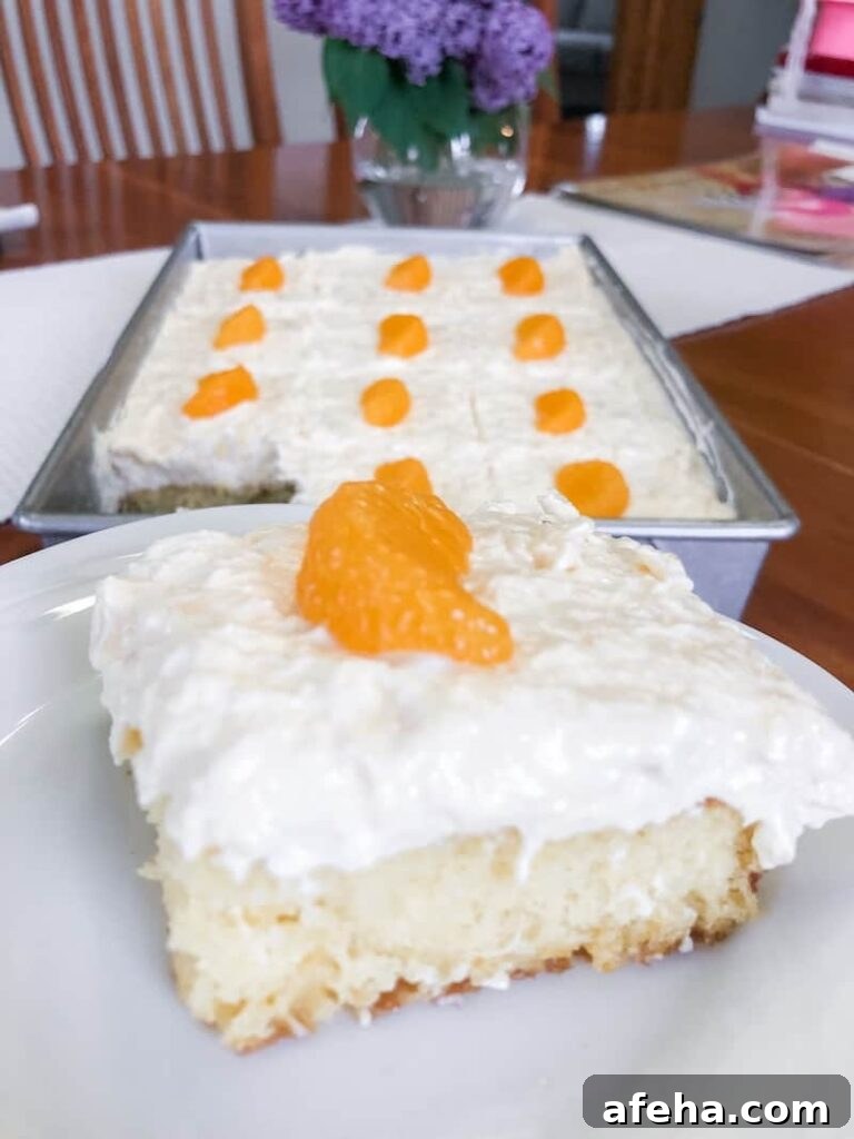 23 Delicious Dairy Recipes to Try Today 8 White cake topped with whipped topping and mandarin orange slices.