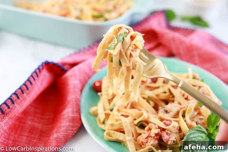 keto baked feta pasta on a fork with low carb pasta dish in the background