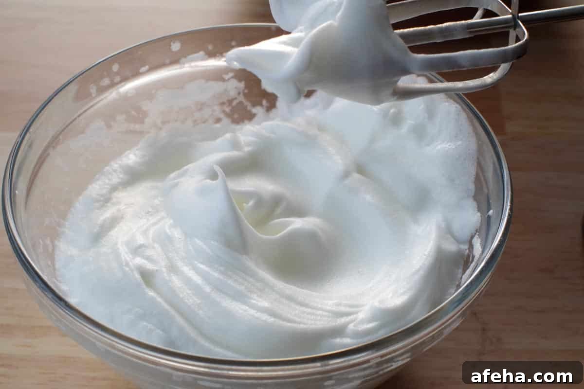 egg whites beaten to stiff in a glass bowl
