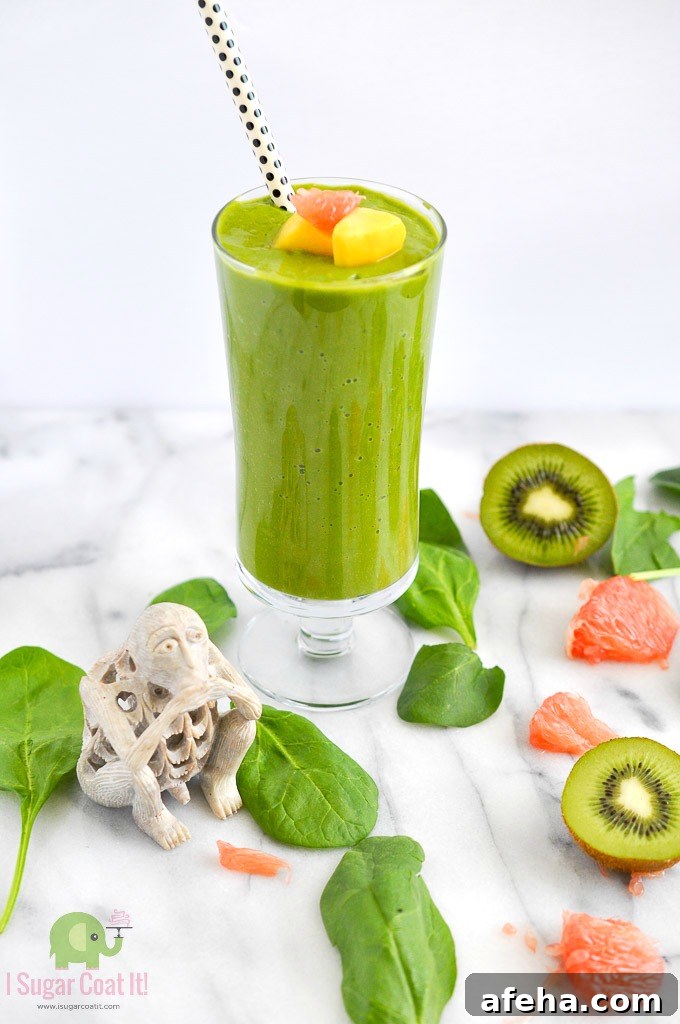Green Super Smoothie with kiwi, spinach, avocado, grapefruit and spirulina.