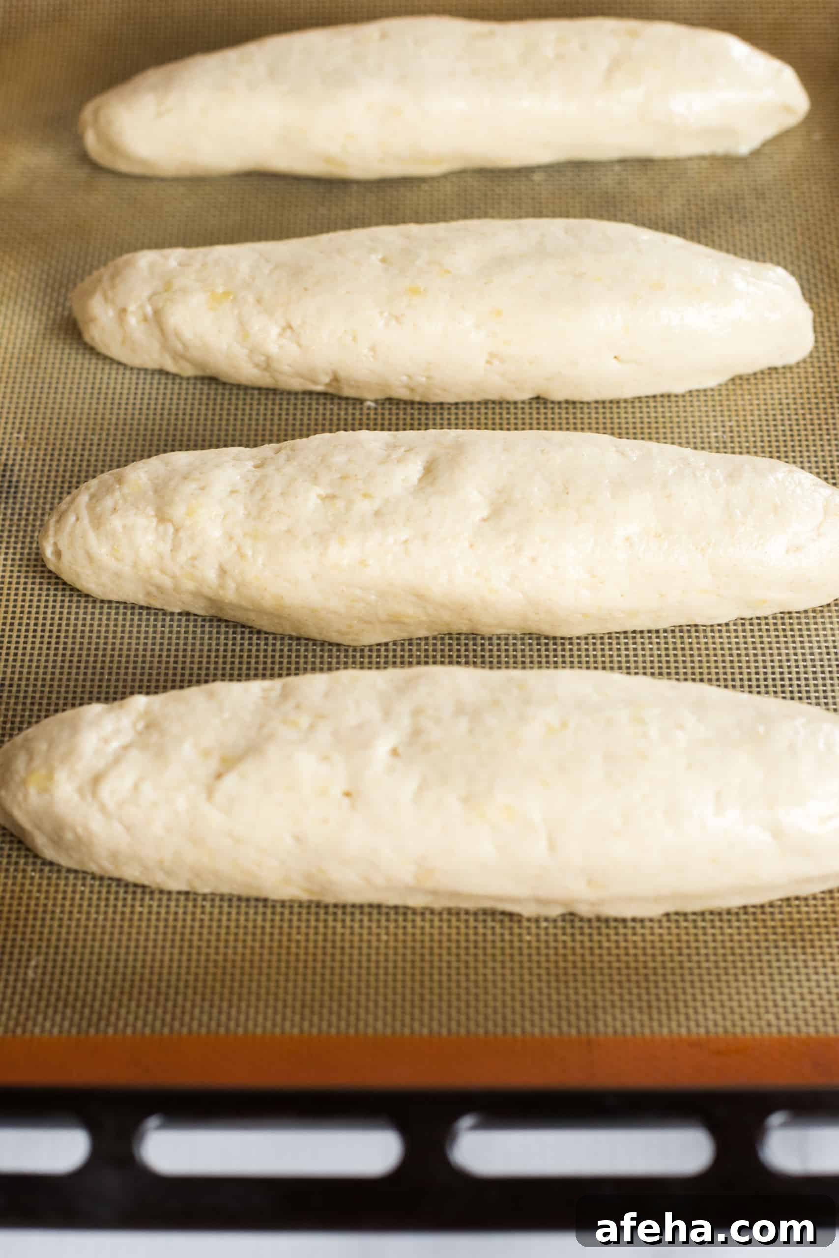 Up close shot of gluten free baguette dough on baking sheet.