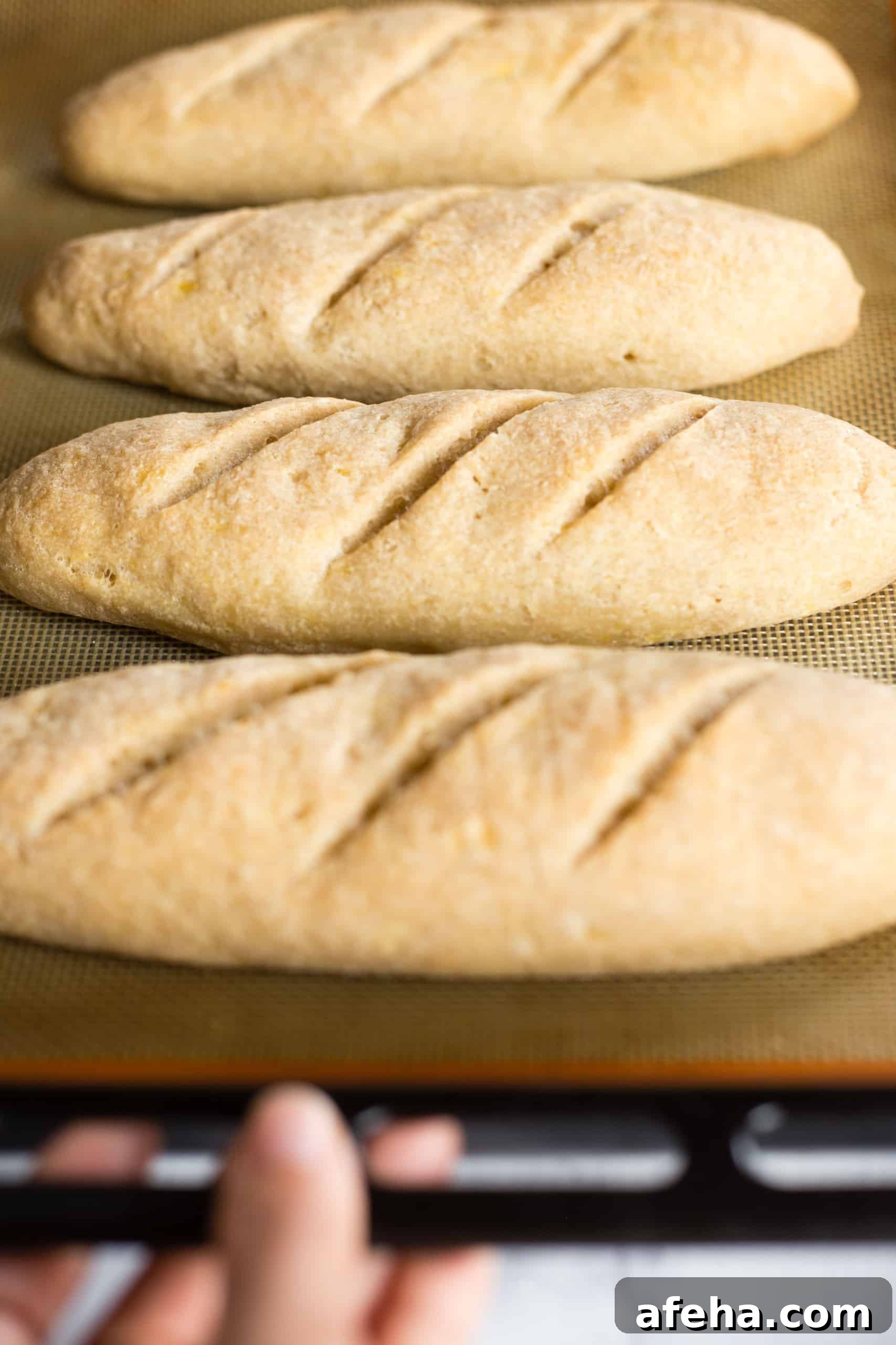 Freshly baked gluten-free baguettes on silpat.