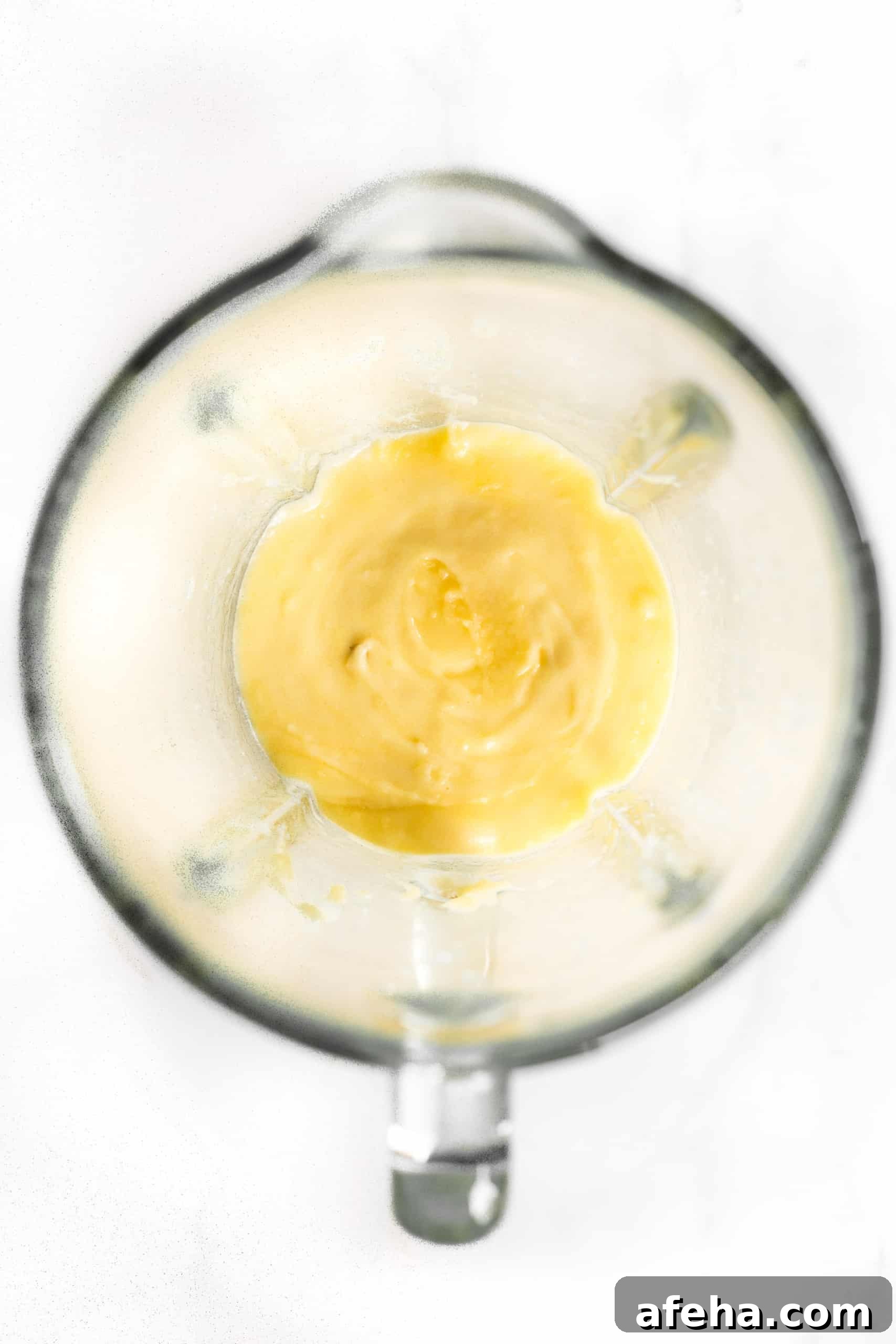 Yellow mixture in blender.