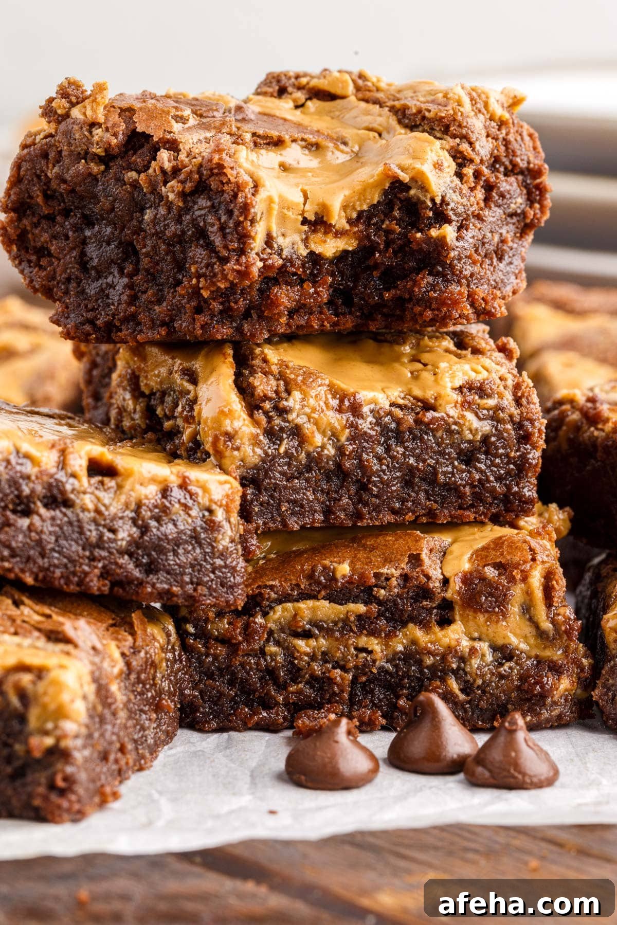a stack of peanut butter brownies a bite taken from the top one
