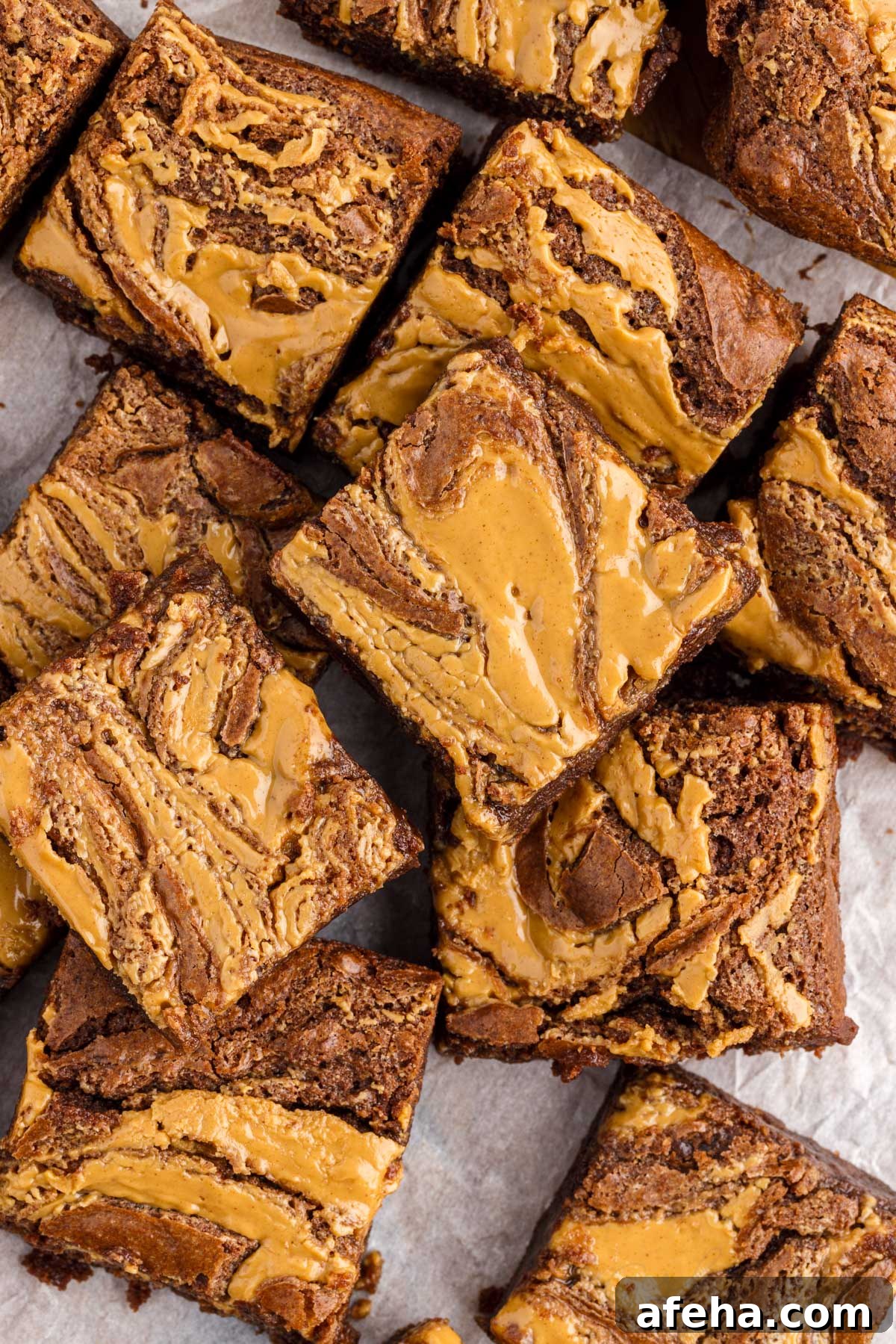 top view of peanut butter brownies cut into squares on parchment paper