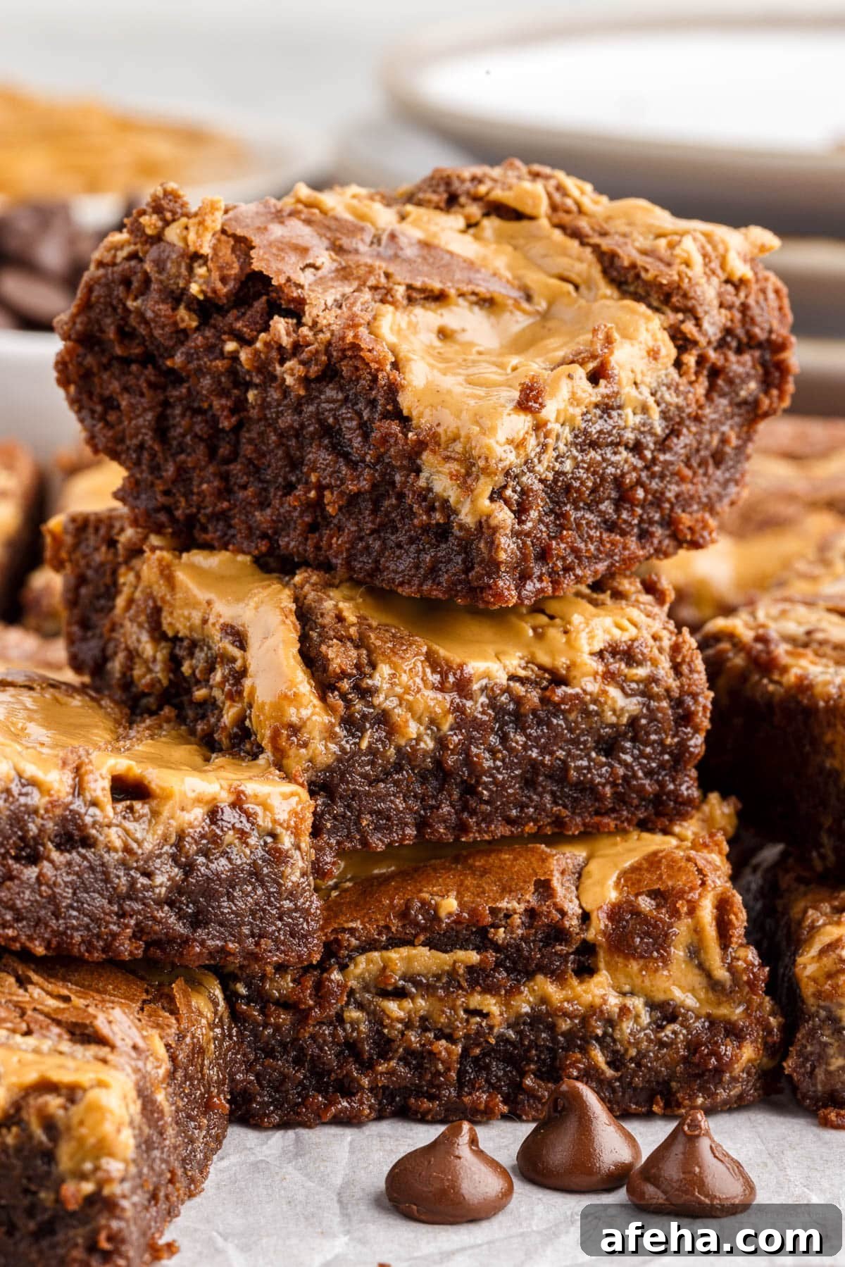 Peanut butter brownies cut into squares stacked on top of each other.