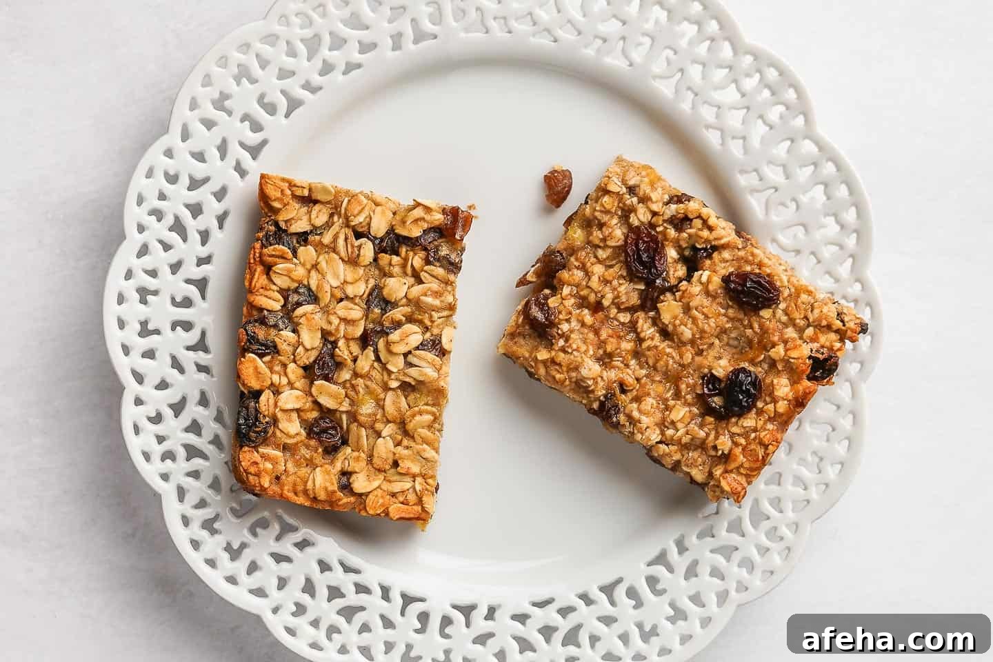 Plate with oatmeal bar made with old fashioned oats and one made with quick oats