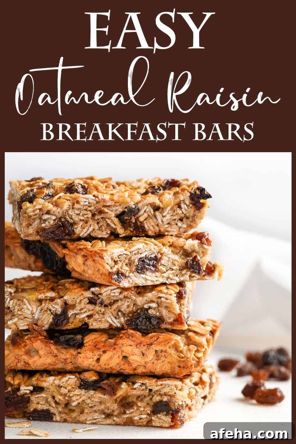 Easy Oatmeal Raisin Breakfast Bars in a stack with raisins on the side