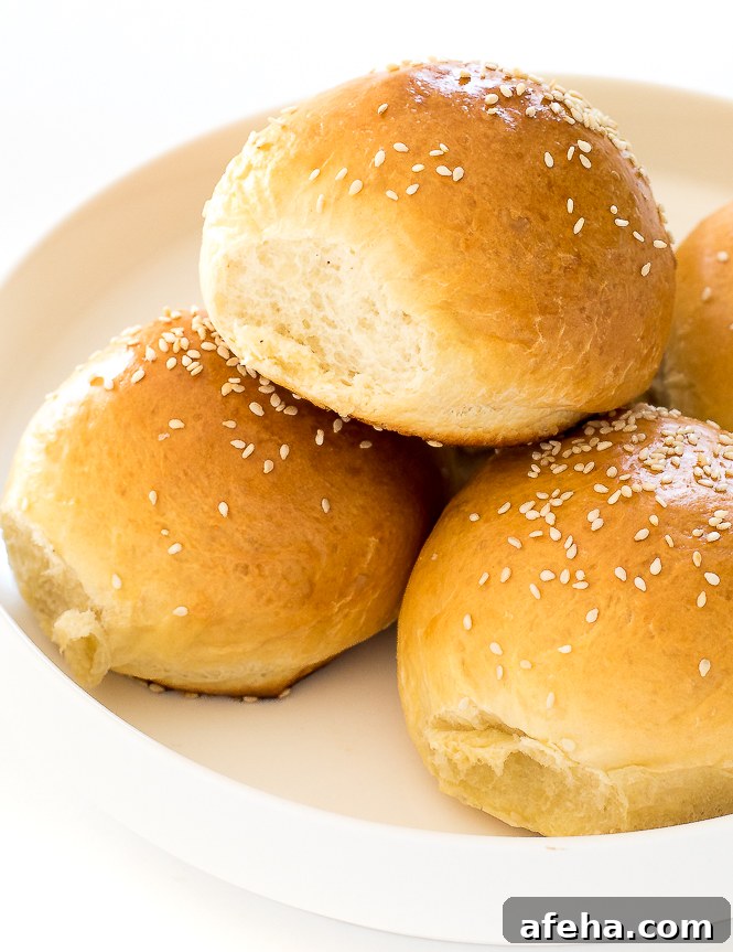 Homemade Burger Buns on a white plate.