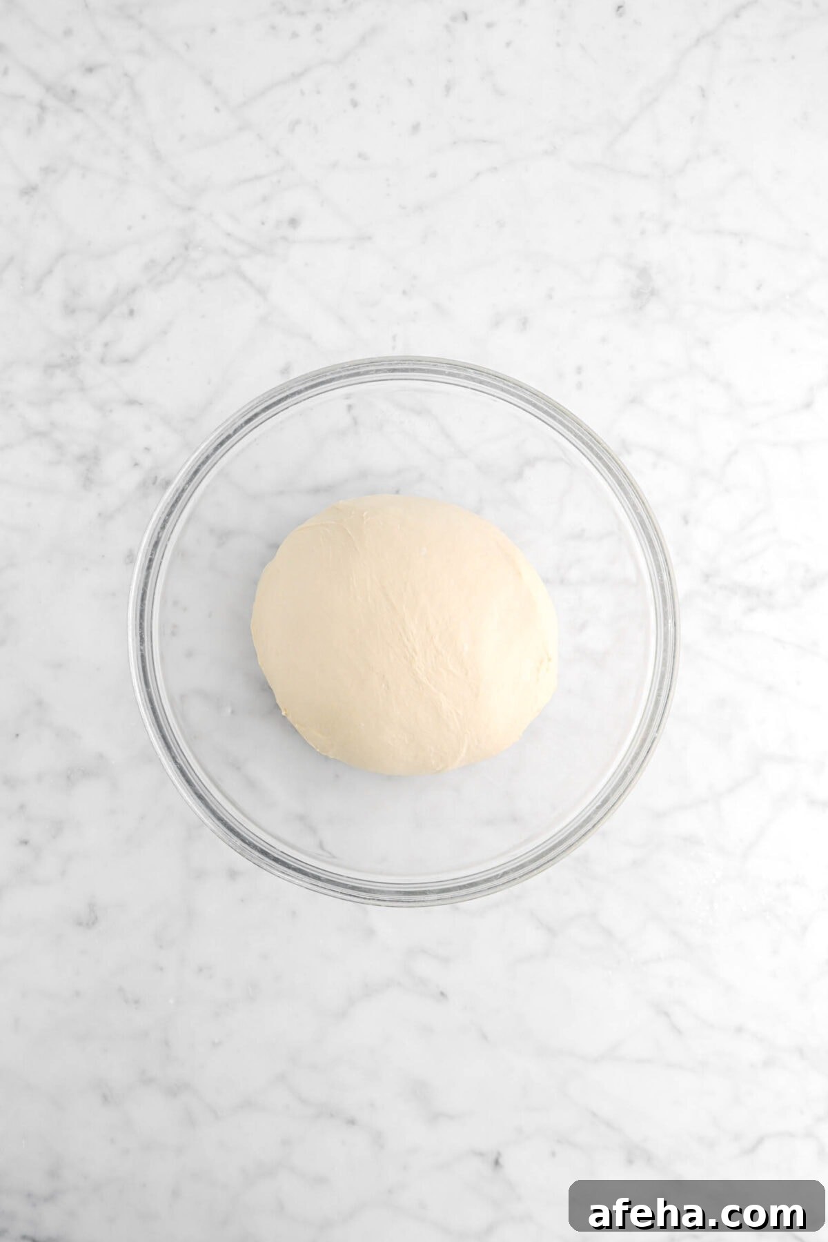 dough in glass bowl