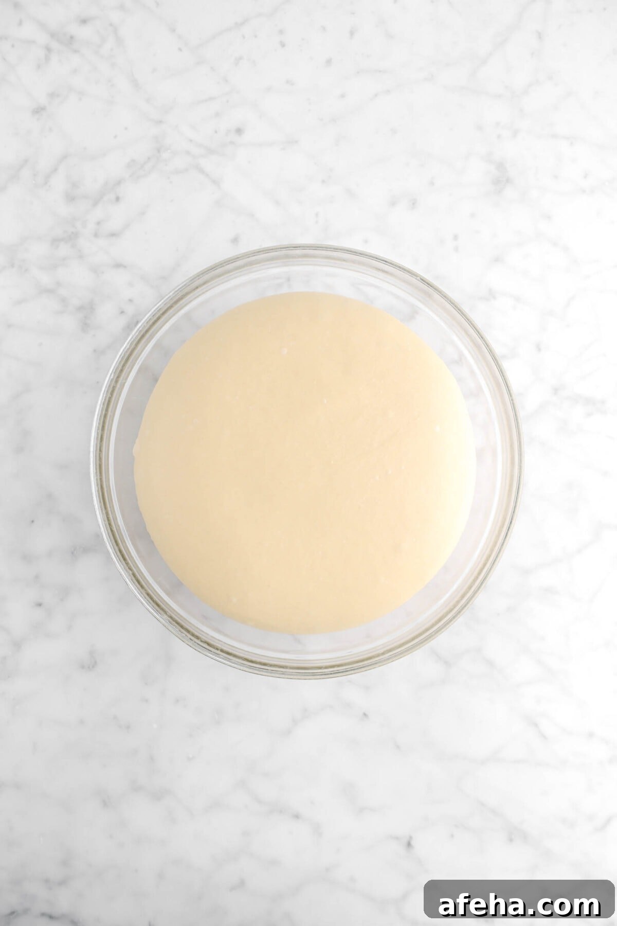 dough doubled in size in glass bowl