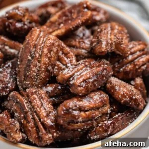 Sugar dusted maple pecans in bowl.