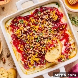 Honey whipped ricotta with cranberry sauce, thyme, pecans and honey over top.