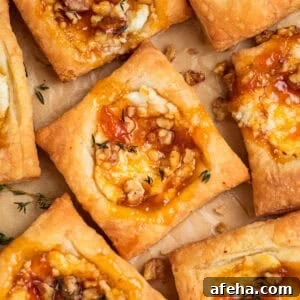 Puff pastry squares with goat cheese and apricot jam.