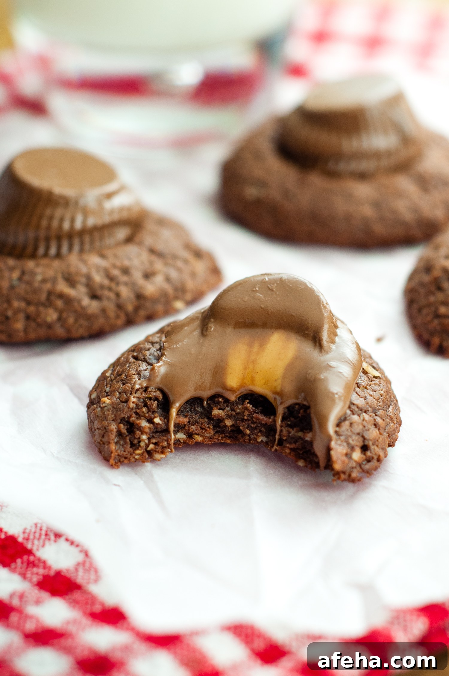 Gluten-Free Nutella Cookies Without Flour — Quick 3-Ingredient Recipe 4 nutella cookie with melting peanut butter cup on top.