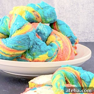 rainbow bagels on a plate sliced