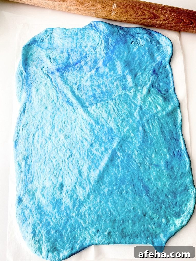 blue bagel dough rolled out