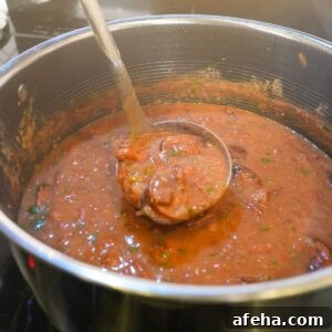 Authentic Red Beans and Rice Recipe for Weeknight Comfort Meal 6 Red beans and sausage in a pot.