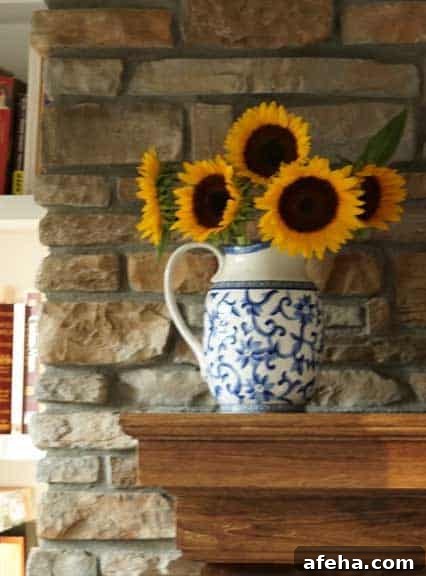 pro cut orange sunflowers on fireplace