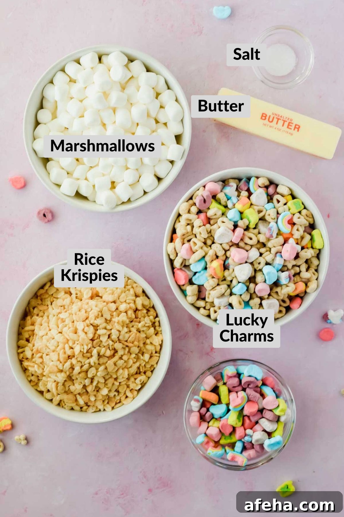 ingredients for lucky charm rice krispie treats in individual bowls with labels.