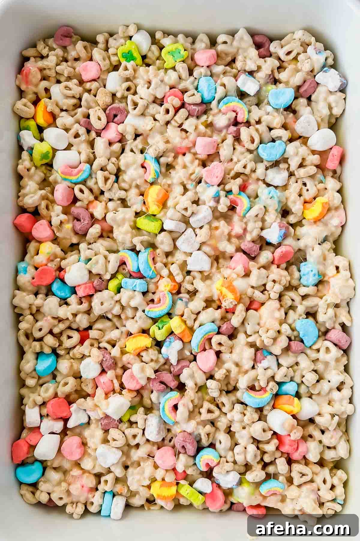 lucky charm rice krispie treats in rectangular baking dish.