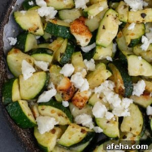 zucchini with feta on white plate
