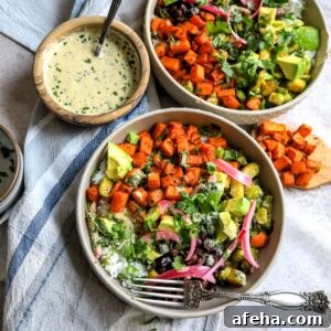 Sweet Potato and veggies in grey Bowls on a dish towel.