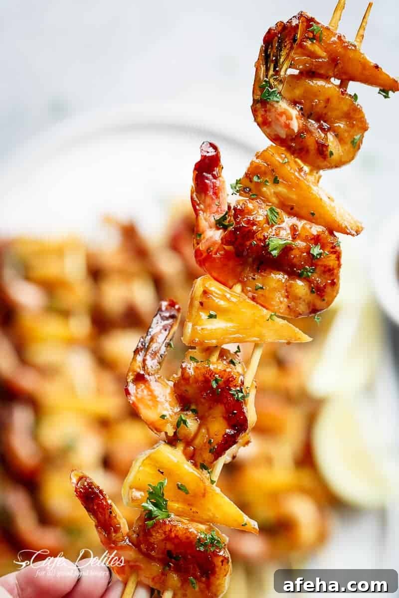 Honey Garlic Butter Shrimp Pineapple Skewers are cooked with honey garlic butter sauce!  