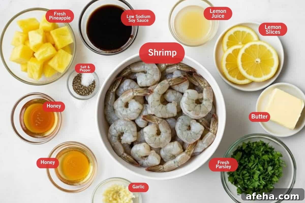 Flat lay photo of ingredient shot of fresh pineapples, low sodium soy sauce, lemon juice, lemon slices, butter, fresh parsley, shrimp, salt and pepper, honey, garlic