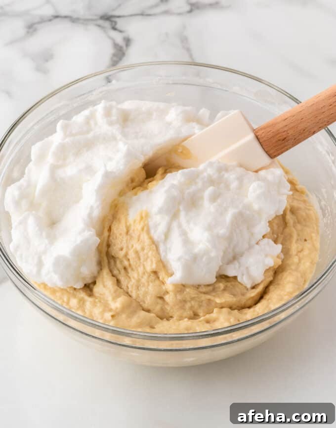 folding egg whites into crispy waffle batter