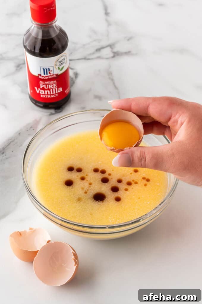separating egg yolk from egg whites to make crispy waffles