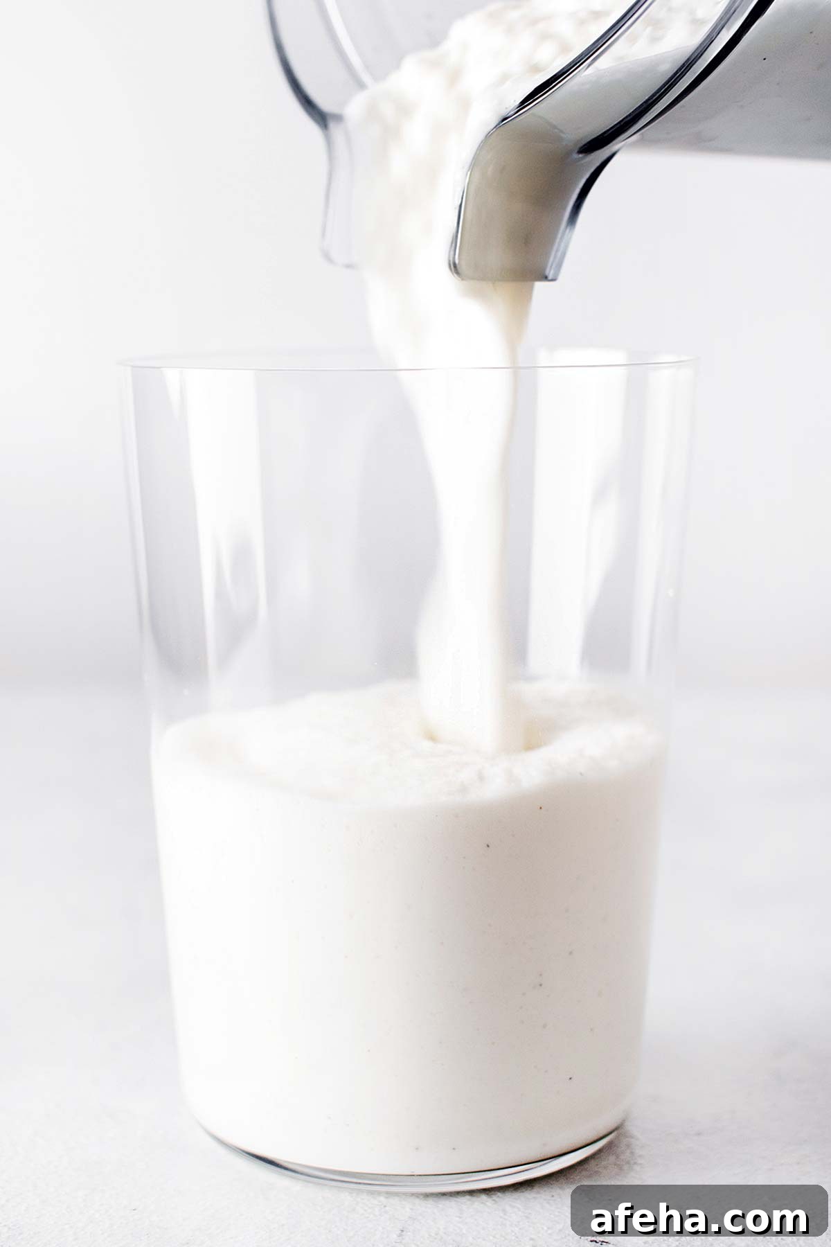 Pouring Frappuccino in a cup. 