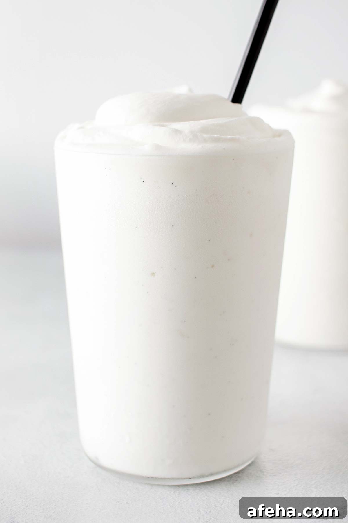 Vanilla Bean Frappuccino with whipped cream in a cup.