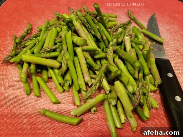 The asparagus stalks are cut into 2