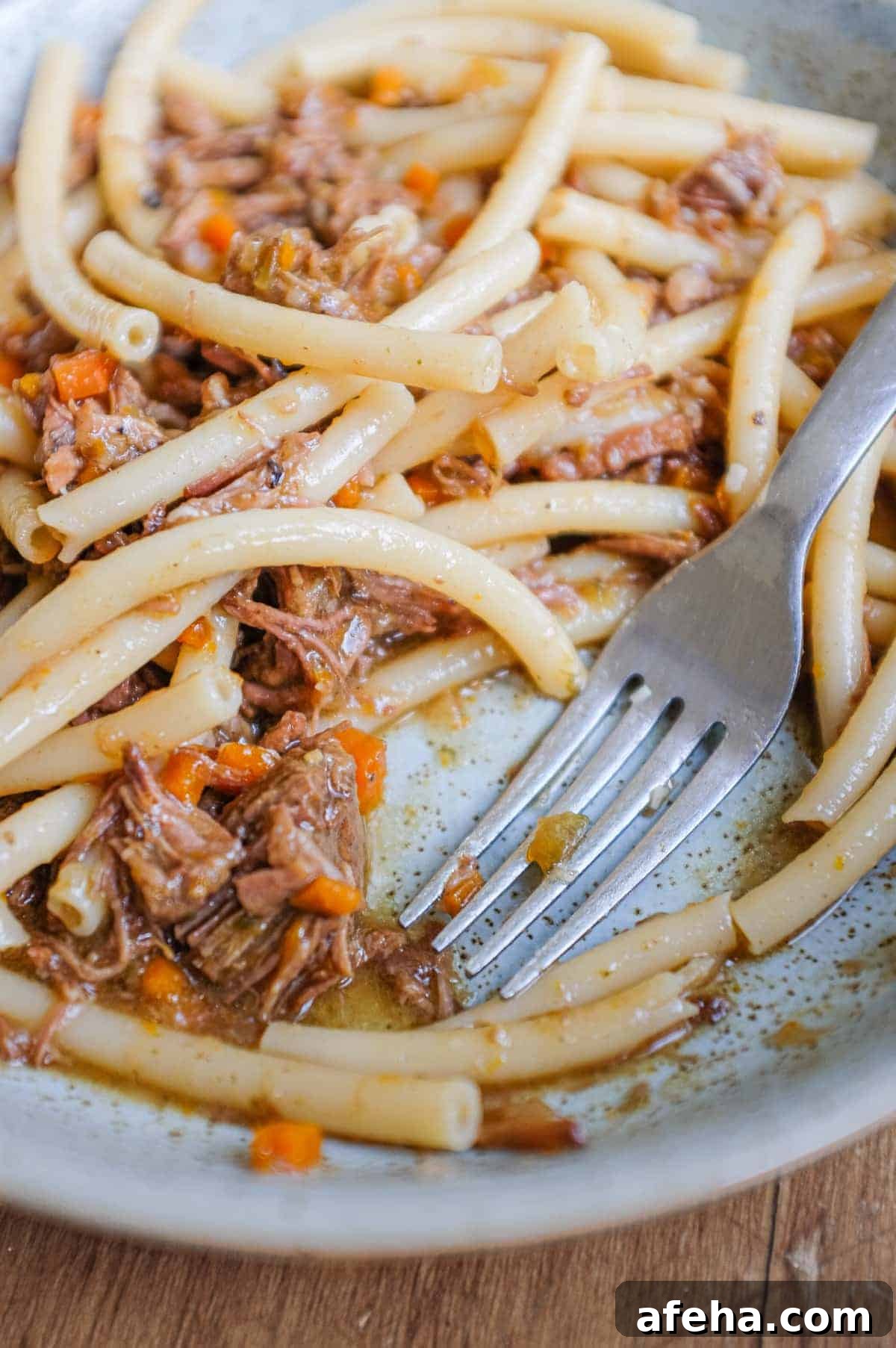 A bowl fo Pasta Alla Genovese with tubular pasta