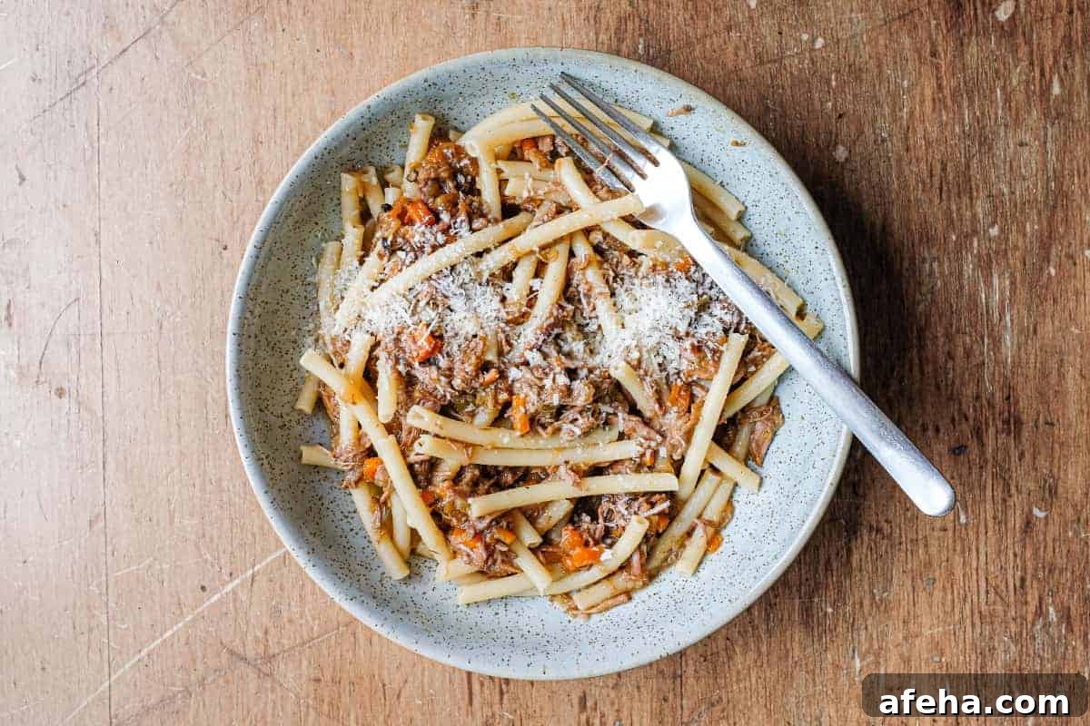 A bowl fo Pasta Alla Genovese with tubular pasta