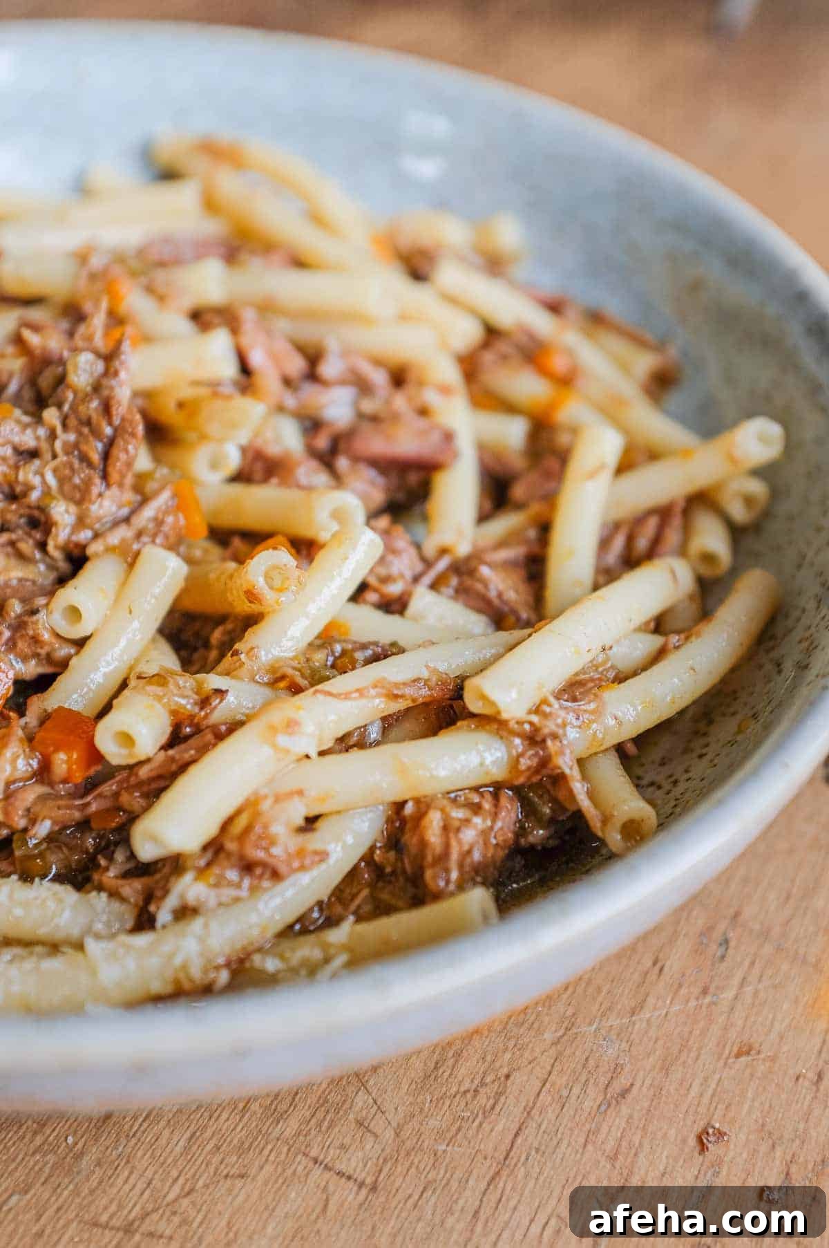 A bowl fo Pasta Alla Genovese with tubular pasta