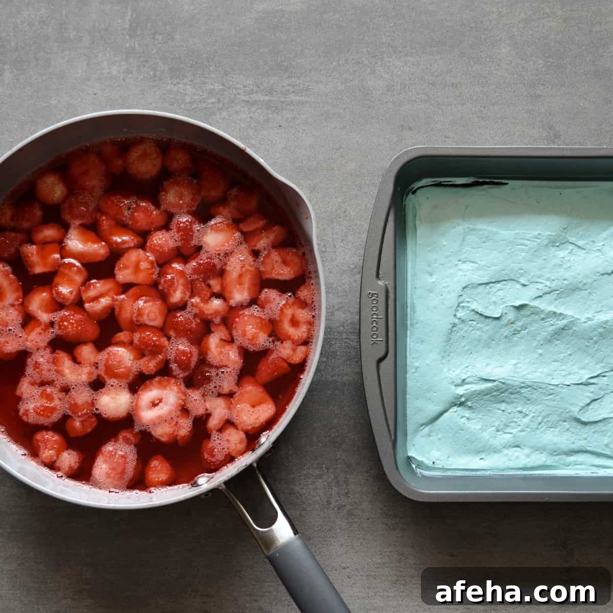 Strawberry jello mixture and blue cheesecake filling
