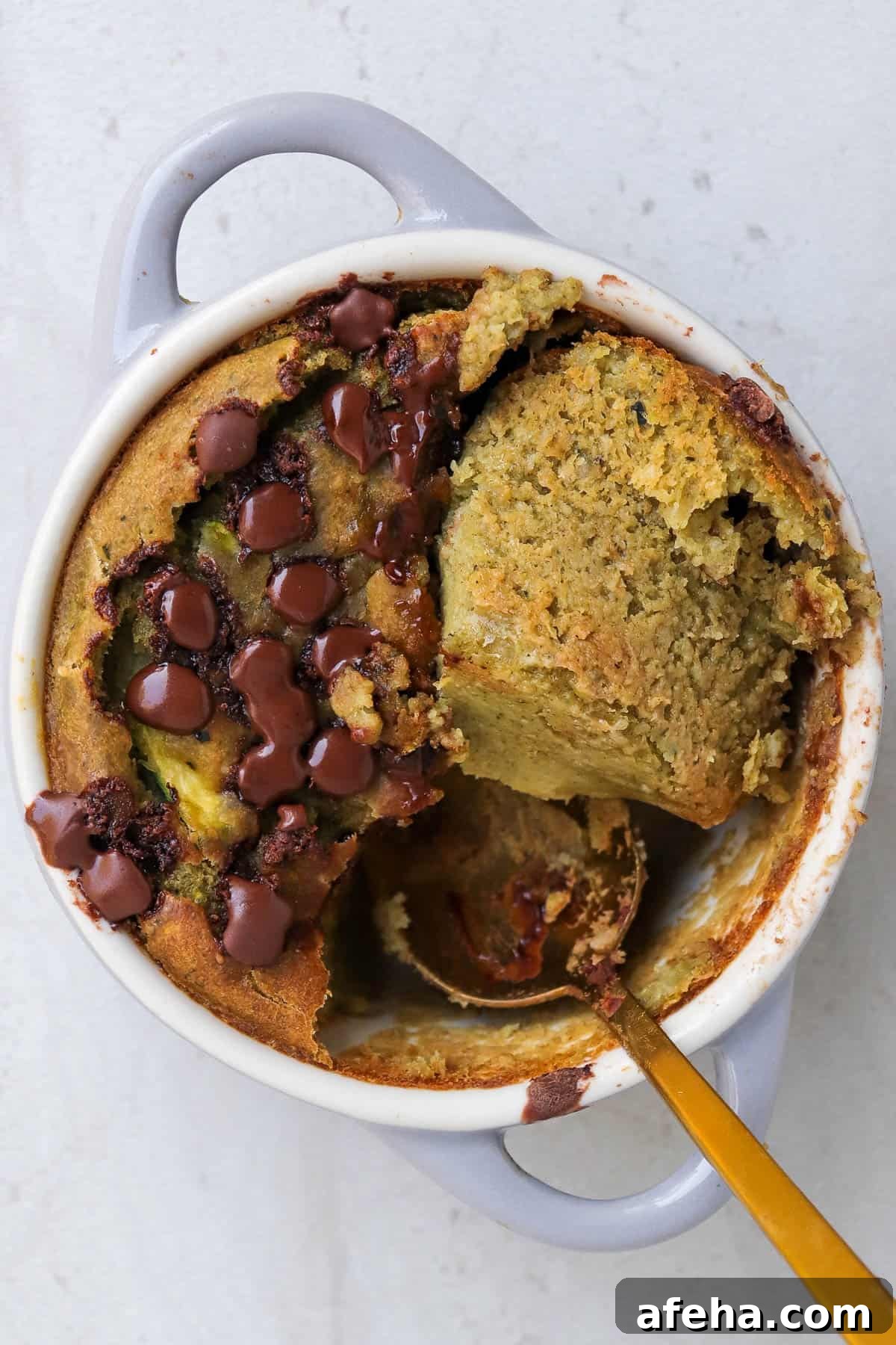 Half of the cake cut in half, flipped over to see texture.