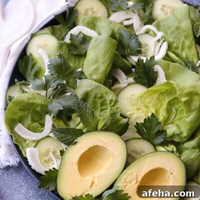 Crisp Butter Lettuce Salad with Lemon Vinaigrette 6 green salad on round platter with serving utensils