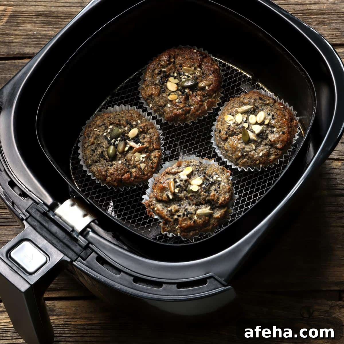A bunch of cupcakes in an air fryer.