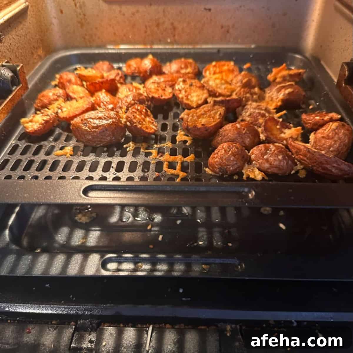 Some crispy potatoes on a rack.