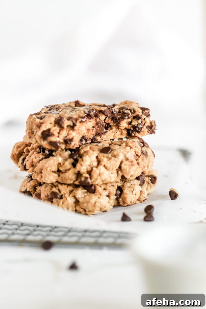 3 delicious homemade gluten free chocolate chip cookies stacked on top of each other 