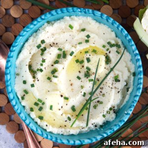 A blue bowl is filled with cauliflower mash.