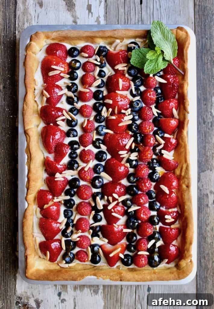 Sheet pan of patriotic fruit dessert pizza.