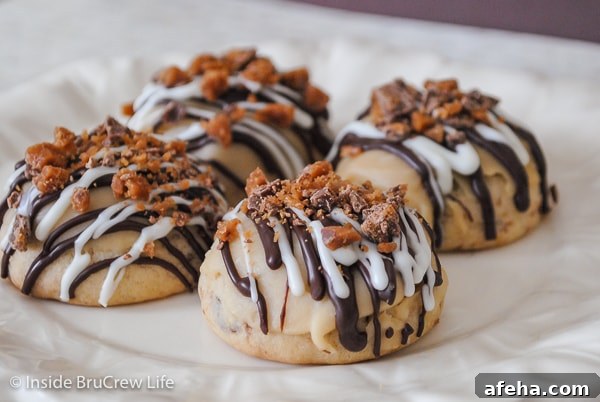 A white plate with shortbread toffee cookies topped with brown sugar glaze and chocolate drizzles.