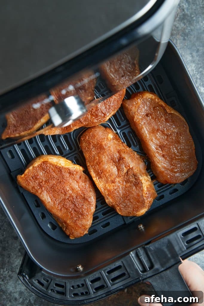 Pork chops in the air fryer basket
