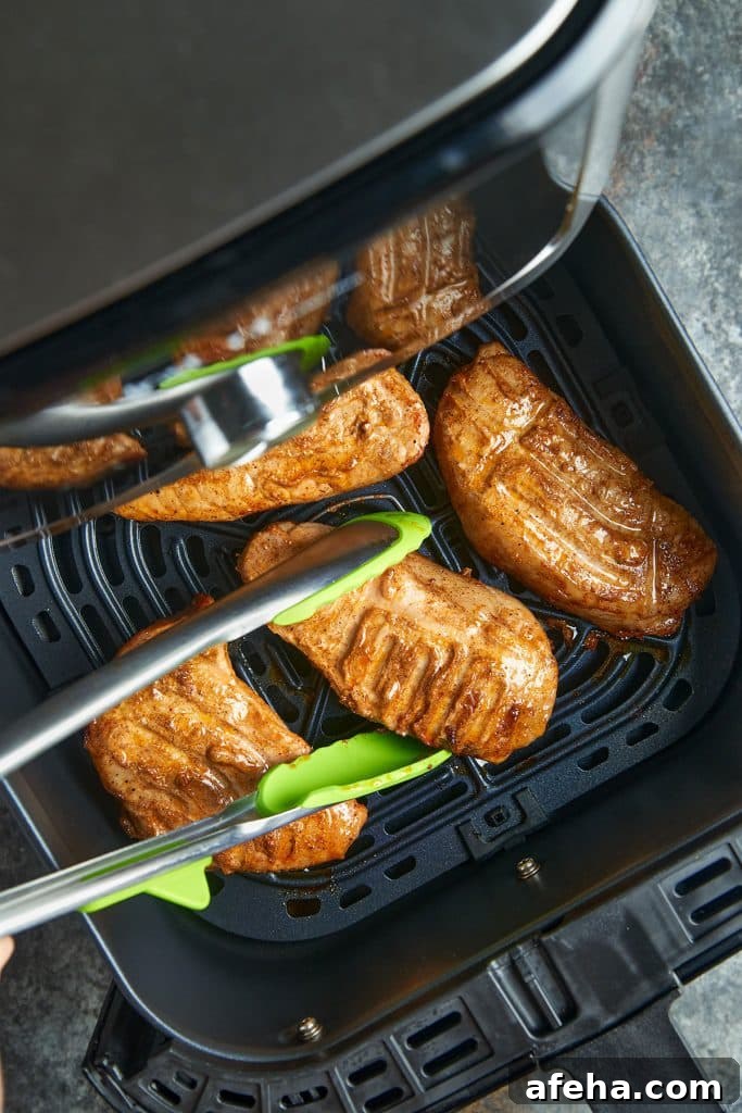 pork chops in air fryer with tongs