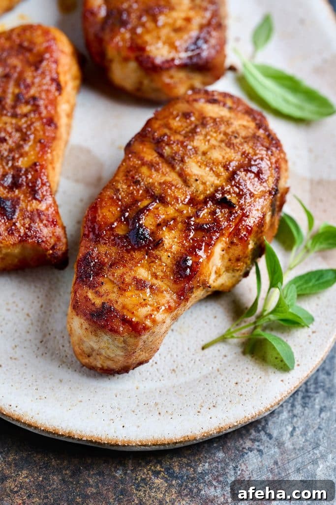Golden brown pork thick-cut pork chop with herbs